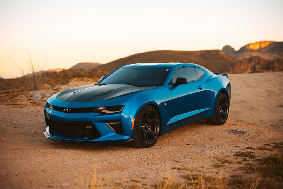 Blue Chevrolet Camaro with performance suspension and lowered stance